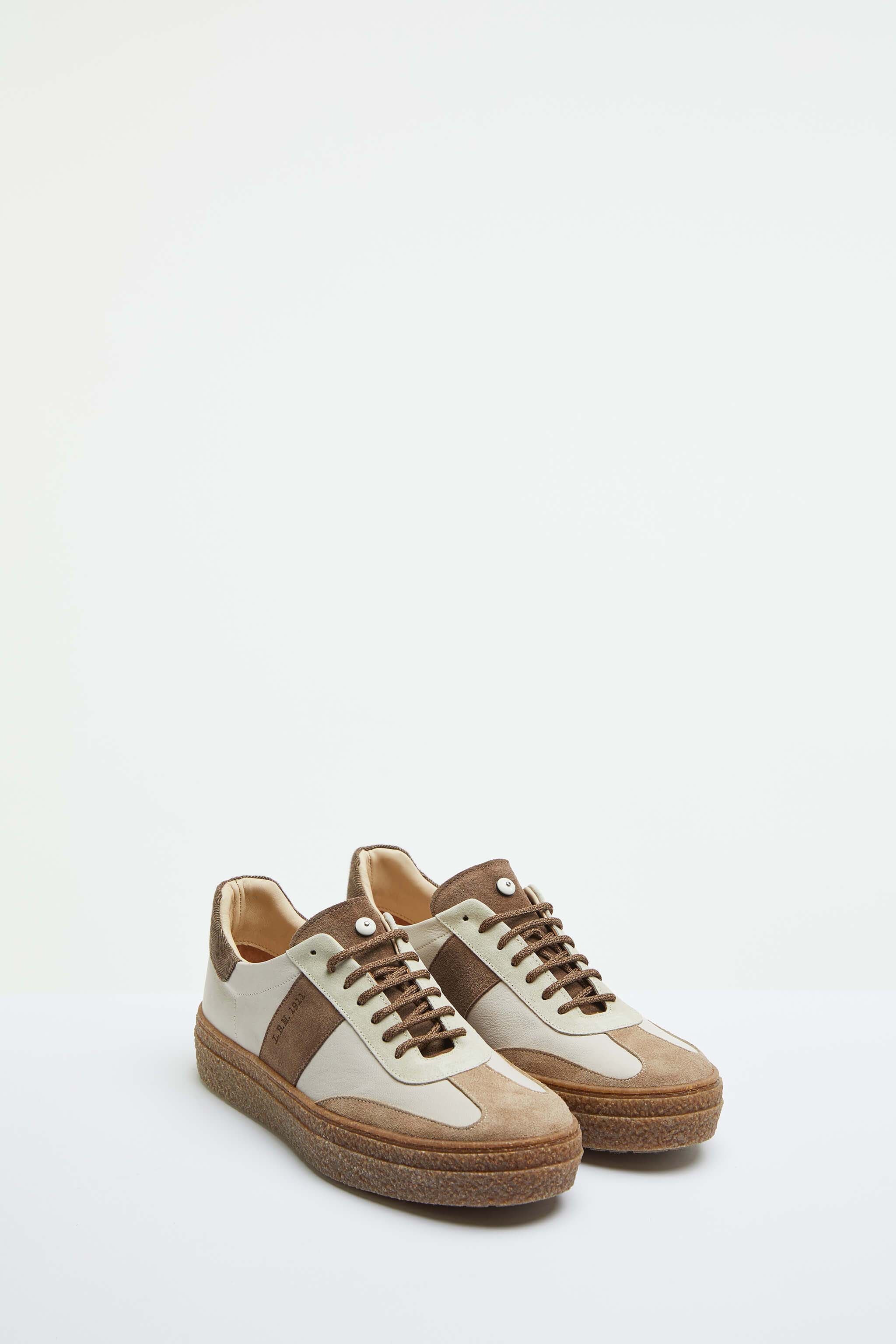 Beige lace-up sneakers with contrasting details