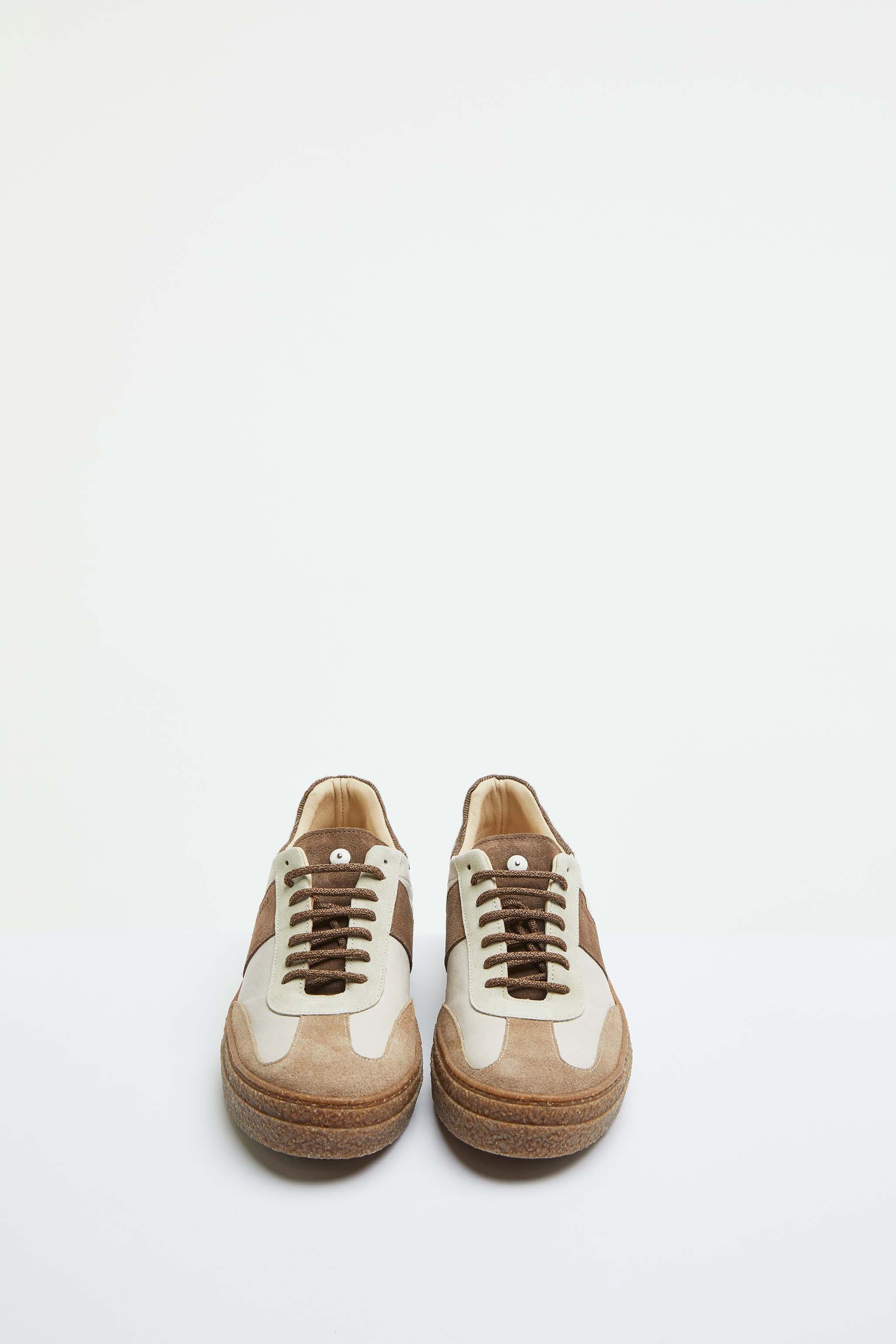 Beige lace-up sneakers with contrasting details