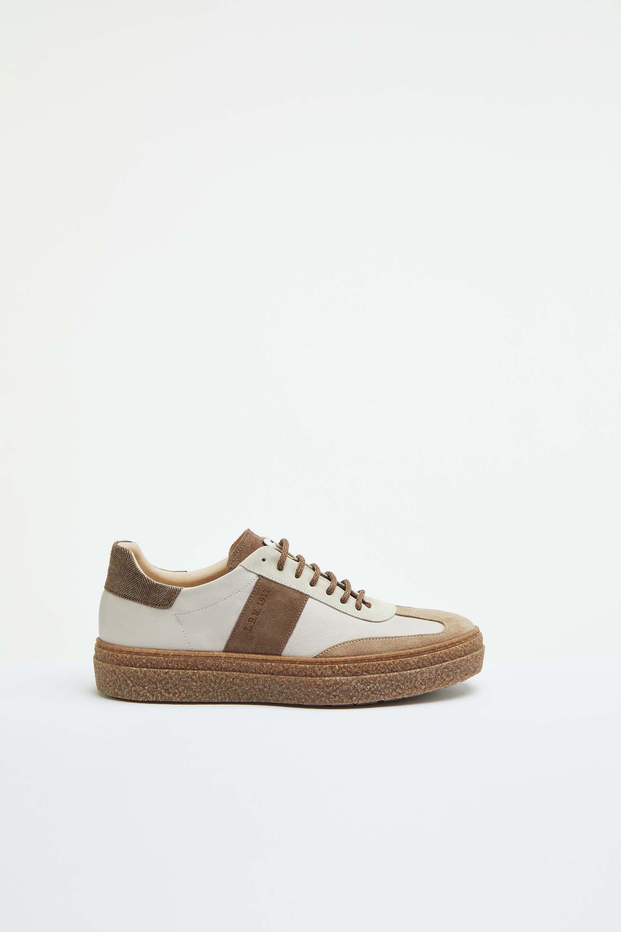 Beige lace-up sneakers with contrasting details