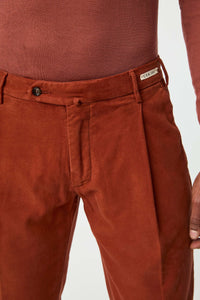 Garment-dyed muddy pants in rust orange brick