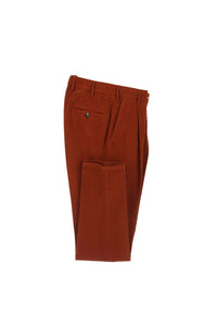 Garment-dyed muddy pants in rust orange brick